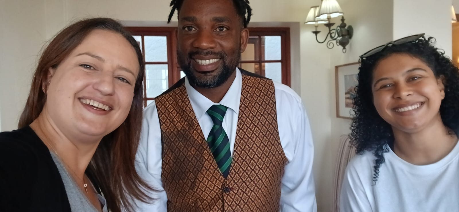 SAFARI.COM's Antoinette (left) and Nikita (right) with St James Manor assistant manager Clive at the opening of the refurbished guesthouses in April.
