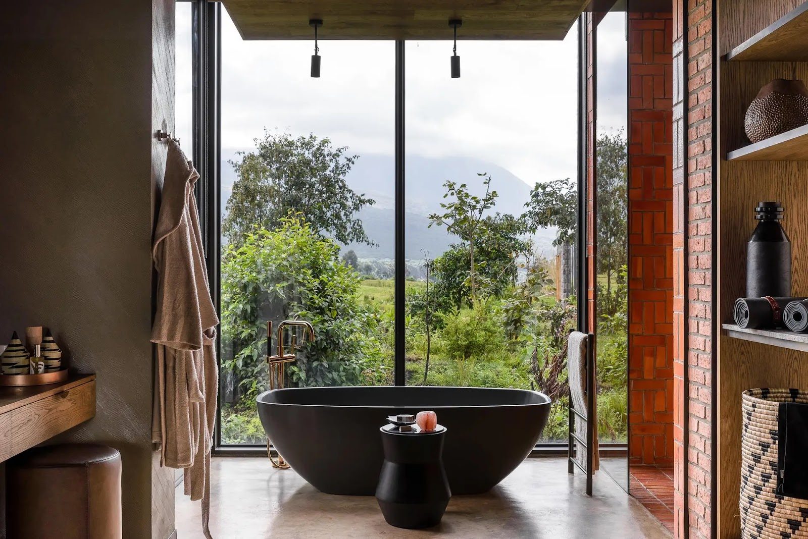 A bath with a view at Singita Kwitonda Lodge, Volcanoes National Park, Rwanda.