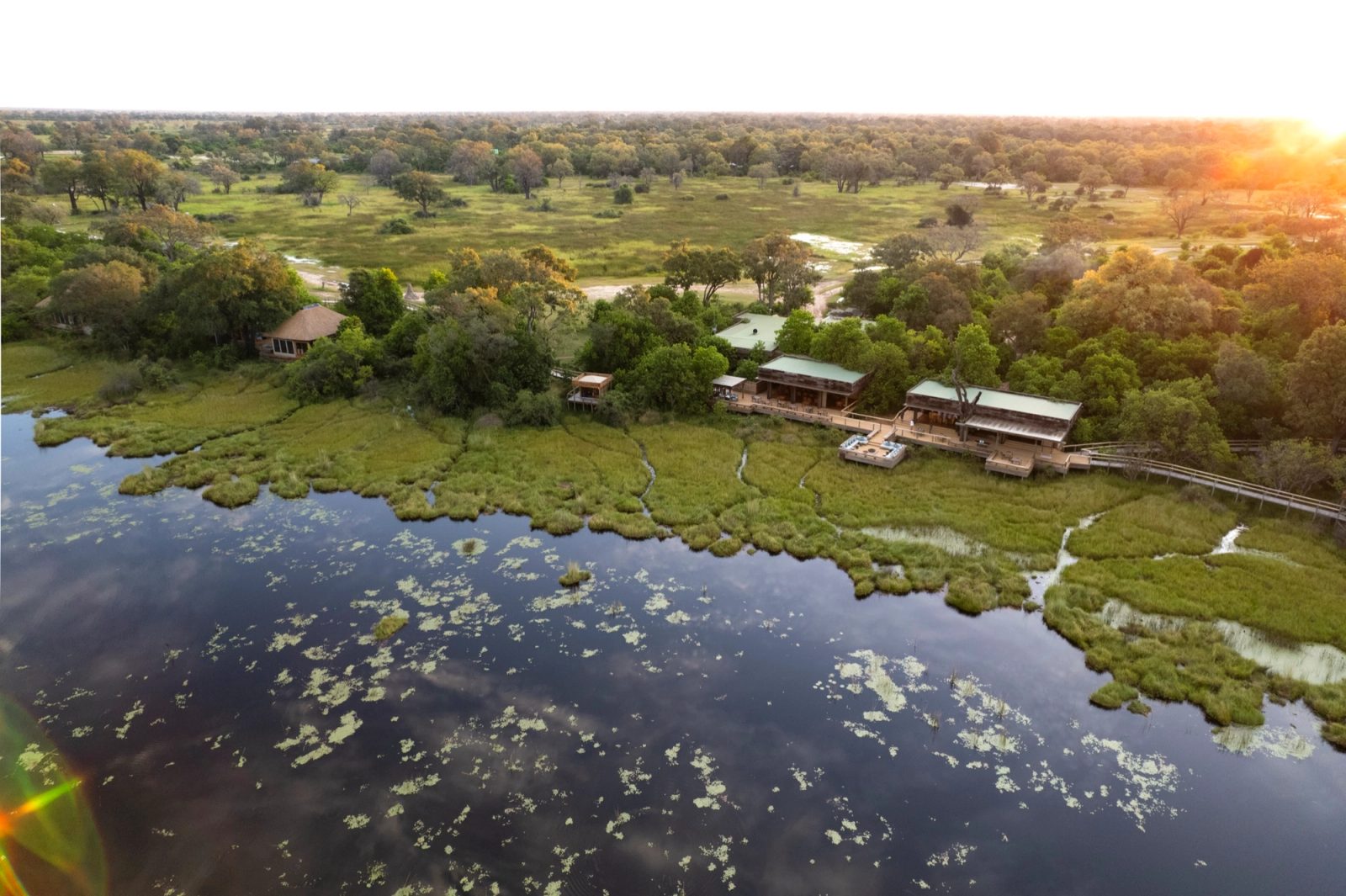 Aerial view of the Okavango Delta waterways with a remote safari camp on an island
